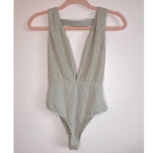 Luxxel Small Beige Bodysuit with Plunging Neckline and Small Gold Pattern